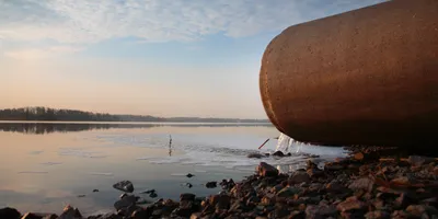Wastewater discharge pipe at shoreline, illustrating pollution monitoring and TOC/TNb analysis needs