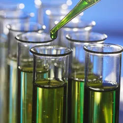 Biomarker testing concept illustrated with a test tube and dropper, representing fluid sample analysis in proteomics workflows.