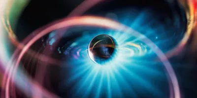 Visualization of atomic structure with glowing electron orbits, symbolizing isotopic differentiation and mass-to-charge separation principles used in isotope ratio mass spectrometry for nuclear chemistry applications.