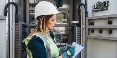 Engineer conducting documentation review at a nuclear facility, representing on-site nuclear quality assurance practices in energy infrastructure.