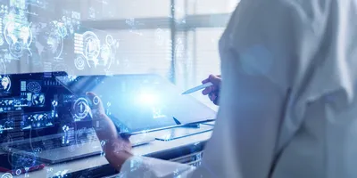 Scientist using a digital tablet and stylus in a high-tech lab environment with data visualizations and interface graphics overlayed, representing innovations in analytical science.