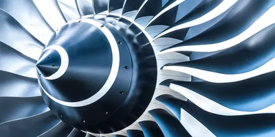 Close-up view of a jet engine turbine fan, illustrating advanced aerospace engineering and its role in jet fuel testing efficiency.