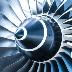Close-up view of a jet engine turbine fan, illustrating advanced aerospace engineering and its role in jet fuel testing efficiency.