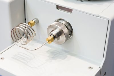 Close-up of a gas chromatograph inlet.