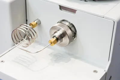 Close-up of a gas chromatograph inlet.