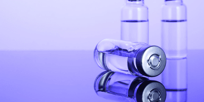 three scientific vials