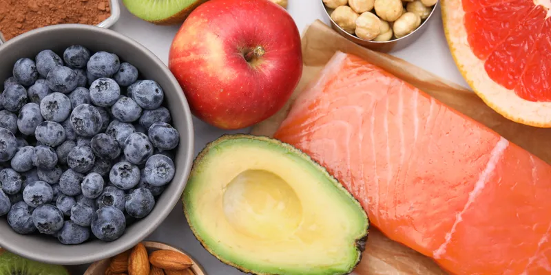 A selection of fruit, vegetables, nuts, pulses and fish.