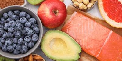 A selection of fruit, vegetables, nuts, pulses and fish.