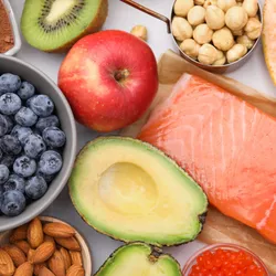 A selection of fruit, vegetables, nuts, pulses and fish.