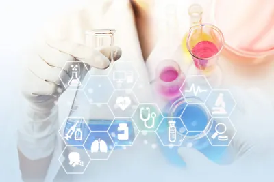 Lab technician holding a flask in DMTA cycle context