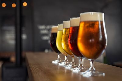 Variety of beer glasses showcasing brewing quality control