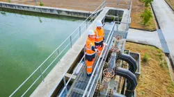 Technicians overseeing PFAS testing processes in a water treatment facility