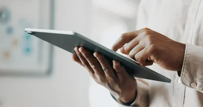 Person using a tablet to access the reference standards selection tool