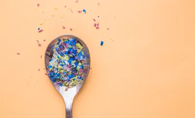Microplastics in a spoon, representing microplastic quantification