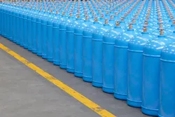 An array of gas tanks, reflecting the helium vs hydrogen cost analysis