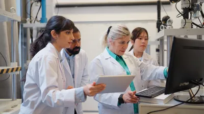 Laboratory team discussing Method 6020B implementation guide.