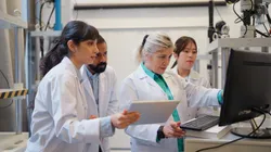 Laboratory team discussing Method 6020B implementation guide.