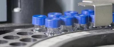 Sample vials in line waiting for analysis inside injection port.