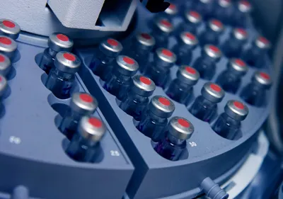 Close-up of vials in an automated laboratory system