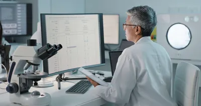Scientist analyzing data from mass spectrometry applications