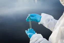 Field technician using PFAS sampling equipment