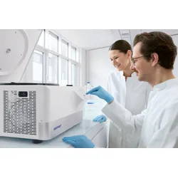 Two researchers in white lab coats and blue gloves operating the Eppendorf Centrifuge 5811 R control panel in a well-lit modern laboratory — a refrigerated centrifuge for multipurpose benchtop workflows.