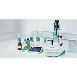 Metrohm IONIC Titrator system with touchscreen display, dosing burettes, reagent bottles, and sample changer for Karl Fischer titration on a white lab bench